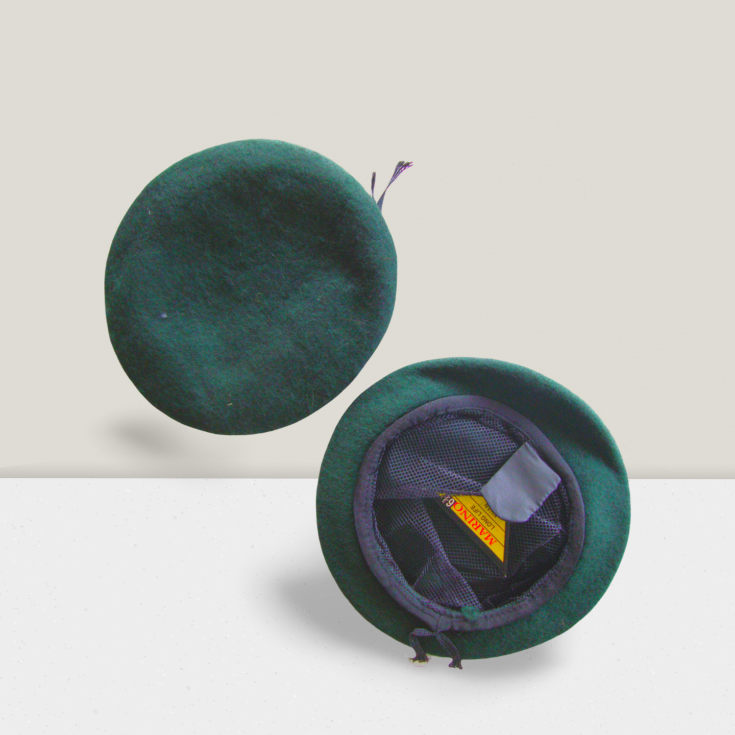 NCC dark green beret cap for boys and girls cadets – one cap shown in top view, another displaying inner mesh lining and sweatband – suitable for Army, Navy, and Air Wing cadet uniforms