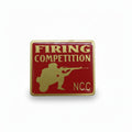 NCC Firing Competition Badge with shooter silhouette in red and gold metal finish