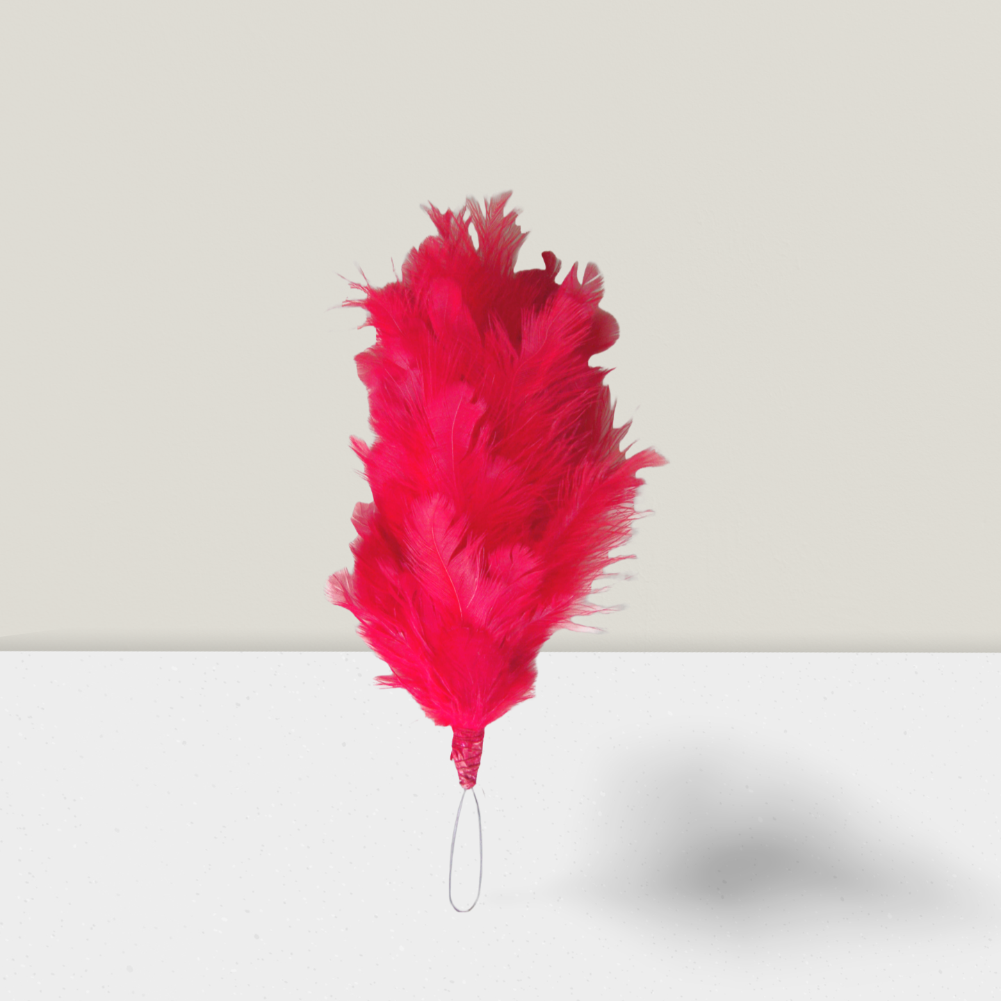 NCC ceremonial red hackle plume for Army, Navy, and Air Wing cadets – bright red feathers with wrapped base and elastic loop for beret cap attachment.