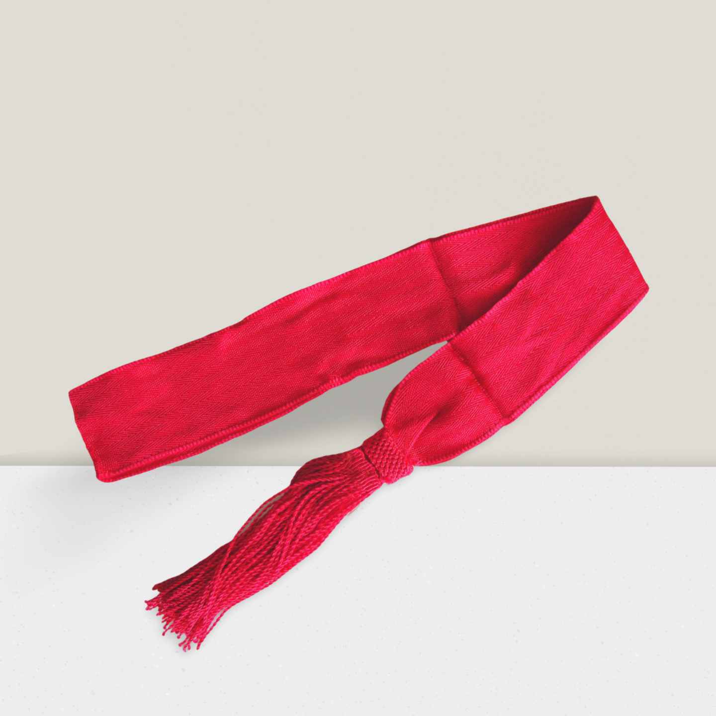 NCC ceremonial plain red sash with knot and tassels, structured uniform dress accessory for cadet parade and official ceremonies, vibrant solid red finish.